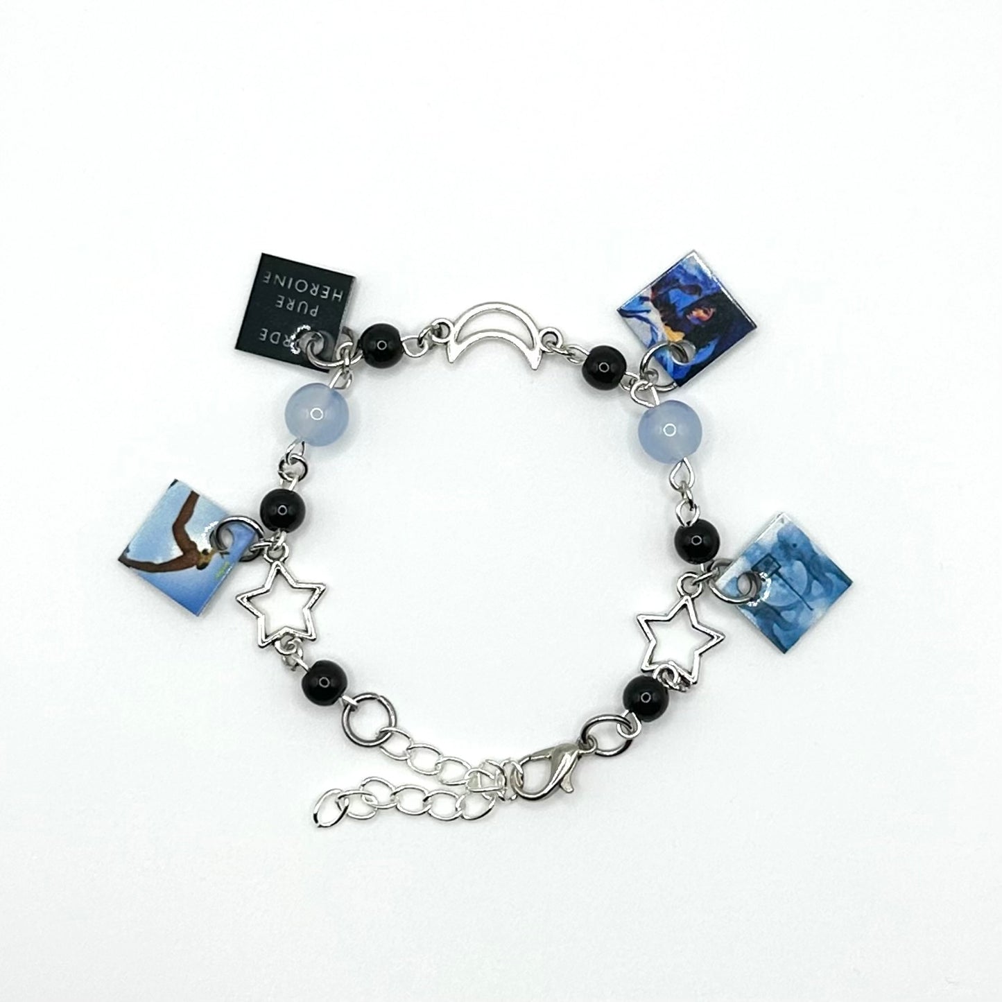 A charm bracelet with miniature (half inch) metal Lorde albums and lobster claw clasp closure.