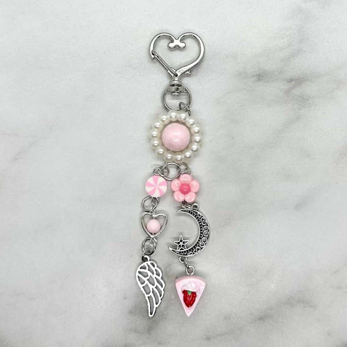 Cute kawaii y2k pink beaded charm keychain with heart shaped closure